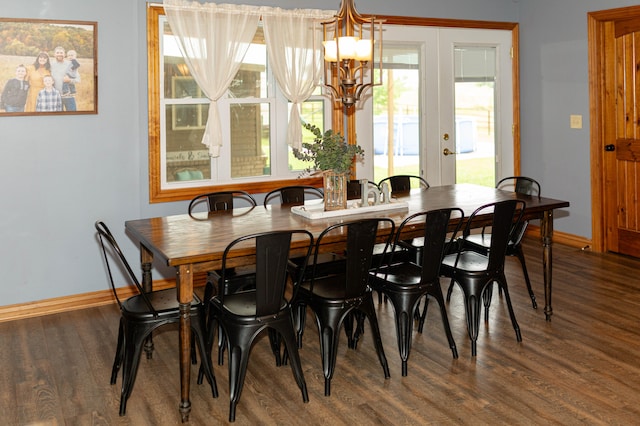 dining space featuring french doors, an inviting chandelier, hardwood / wood-style floors, and a wealth of natural light