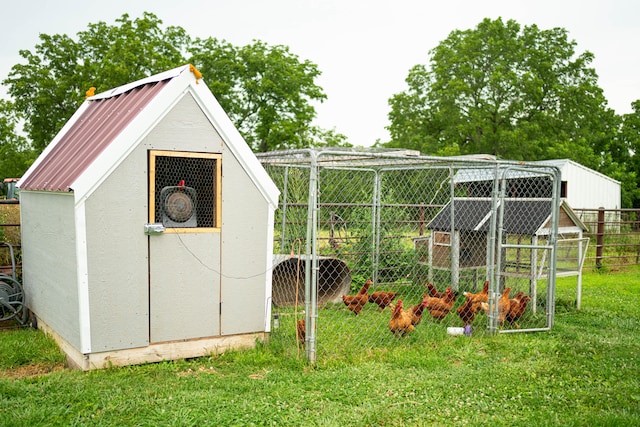 view of outdoor structure with a lawn