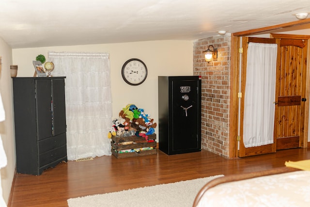 bedroom with hardwood / wood-style floors