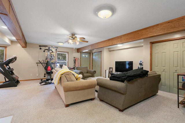 carpeted living room featuring ceiling fan