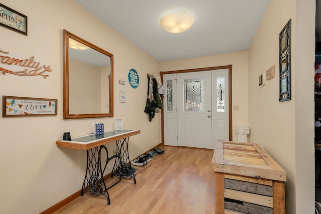 foyer entrance with light wood-type flooring