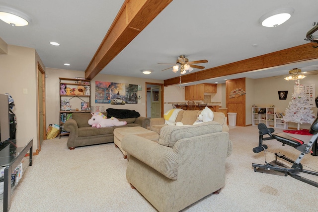 living room with light carpet, beam ceiling, and ceiling fan