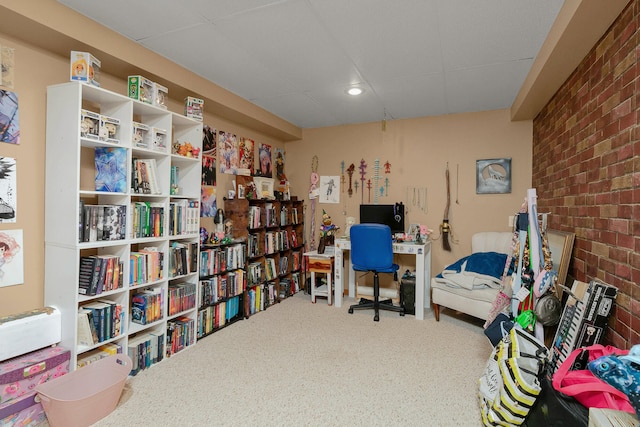 home office featuring brick wall