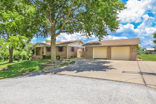 view of front facade with a front yard and a garage