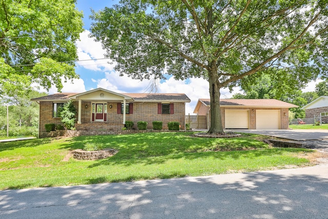 ranch-style home featuring a garage and a front yard