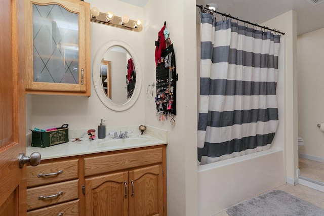 bathroom with tile patterned floors, vanity, and toilet