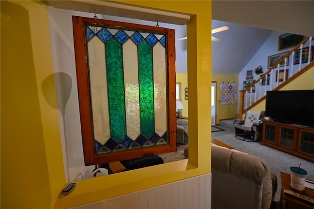 doorway to outside featuring carpet floors and vaulted ceiling