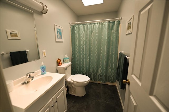 bathroom with tile patterned floors, vanity, walk in shower, and toilet