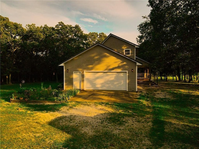 garage at dusk with a lawn