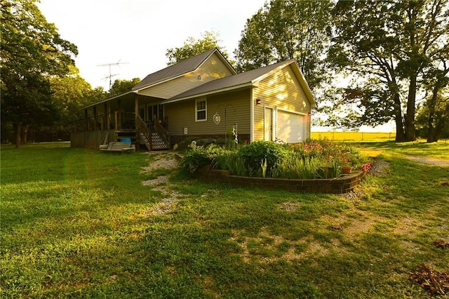 view of side of property with a lawn