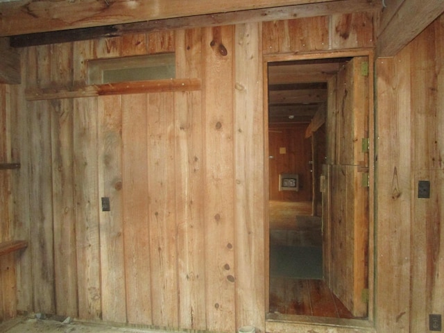 misc room featuring wooden walls