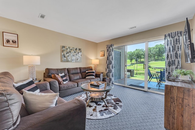 carpeted living area with visible vents