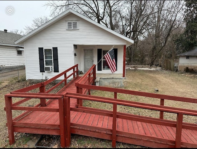 view of front of home with a front yard and cooling unit