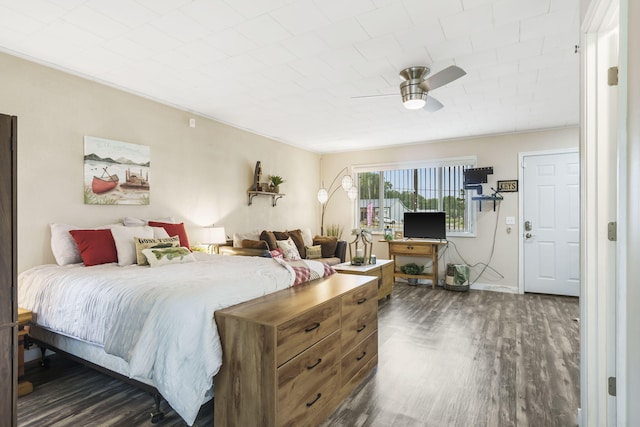 bedroom featuring ceiling fan and dark wood-type flooring