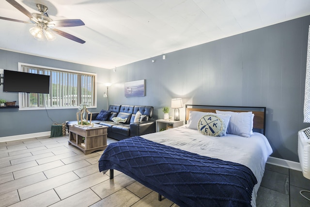 bedroom with baseboards and ceiling fan