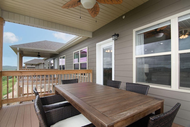 wooden deck featuring ceiling fan