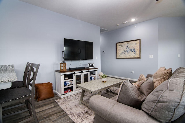 living room featuring dark wood-type flooring