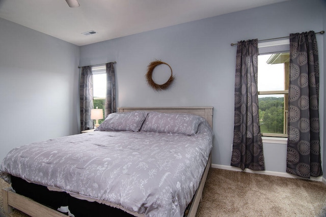 bedroom featuring ceiling fan and carpet floors