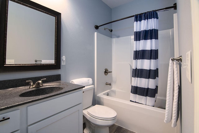 full bathroom featuring wood-type flooring, shower / tub combo, vanity, and toilet