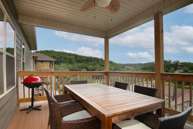 wooden terrace featuring ceiling fan