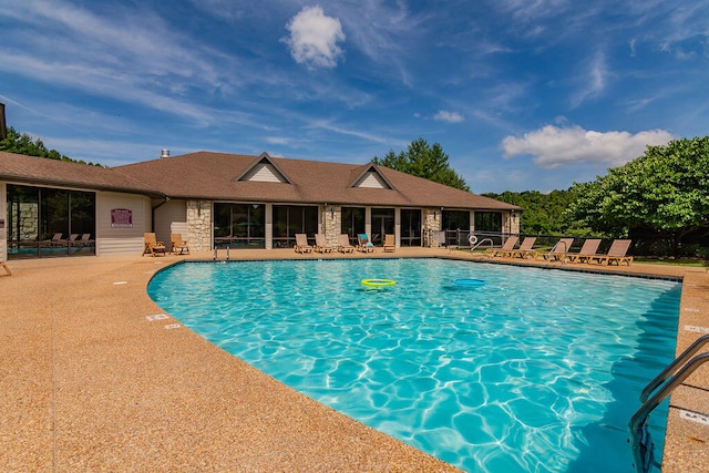 view of swimming pool with a patio area