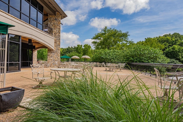 view of yard with a patio and a balcony