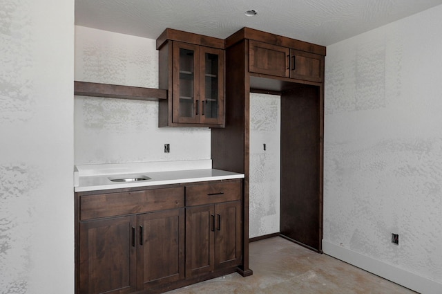 kitchen featuring dark brown cabinetry