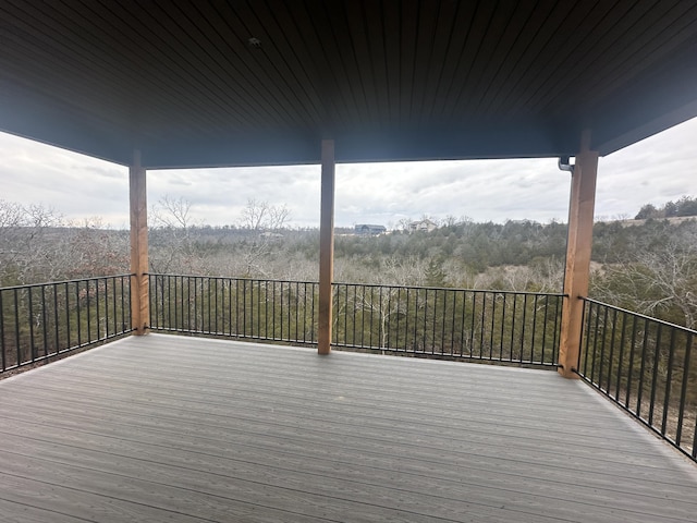 wooden terrace with a forest view