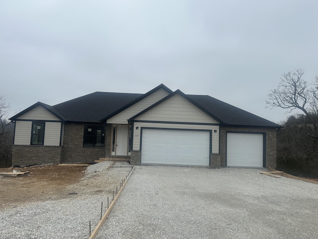 ranch-style house featuring a garage