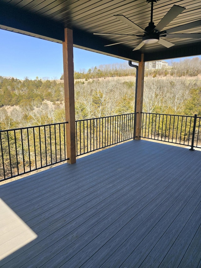 wooden terrace featuring a ceiling fan