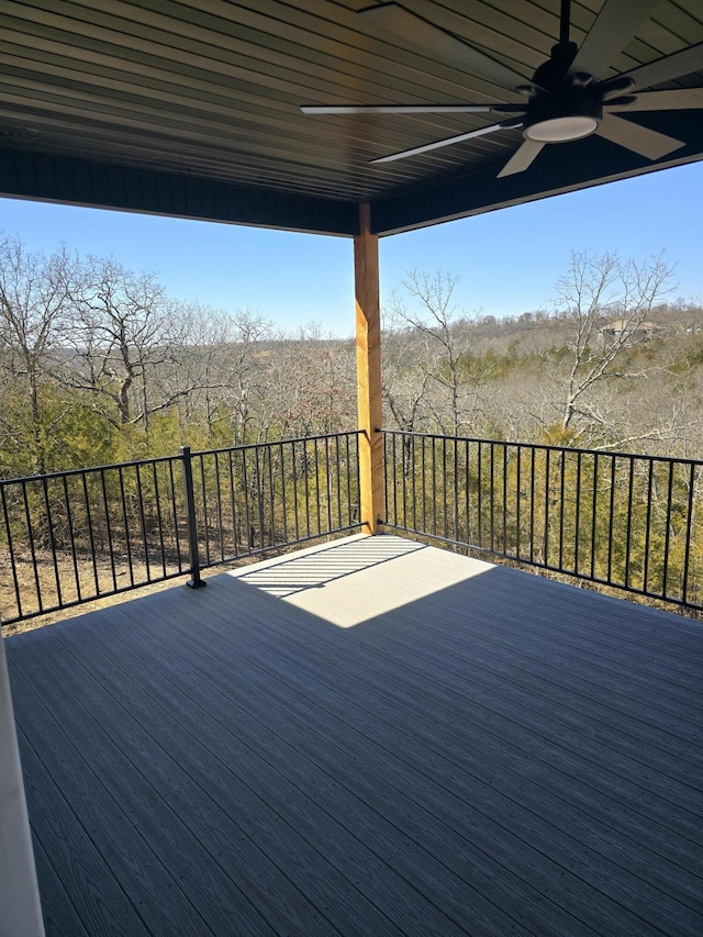 wooden deck featuring a ceiling fan