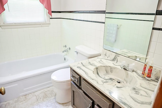 full bathroom featuring vanity, toilet, shower / washtub combination, tile walls, and tile patterned flooring