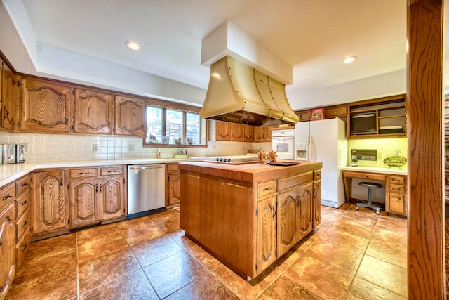 kitchen featuring white appliances, island exhaust hood, backsplash, and a center island