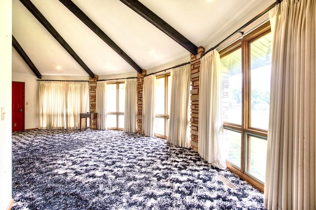 miscellaneous room featuring lofted ceiling with beams and carpet flooring