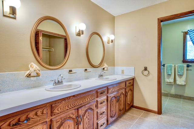 bathroom featuring vanity and tile patterned flooring