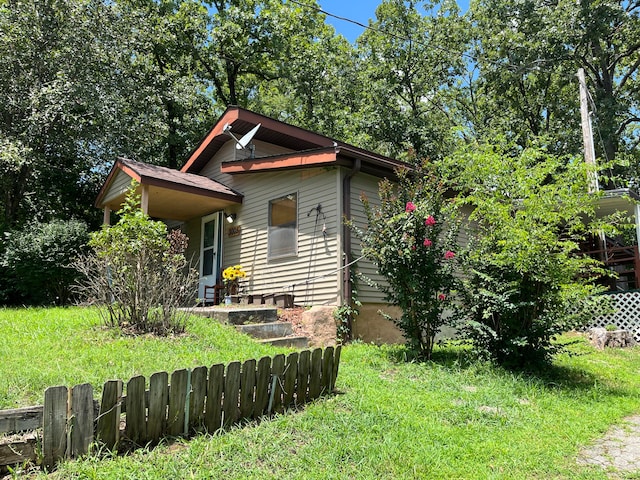 view of front of home with a front yard