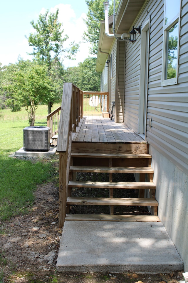 wooden terrace featuring central air condition unit