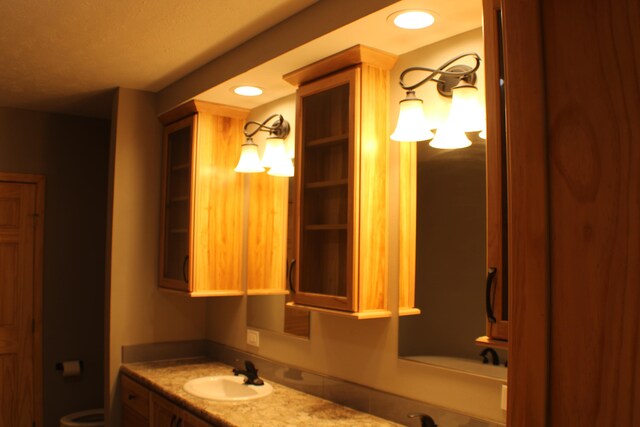 bathroom with vanity and toilet