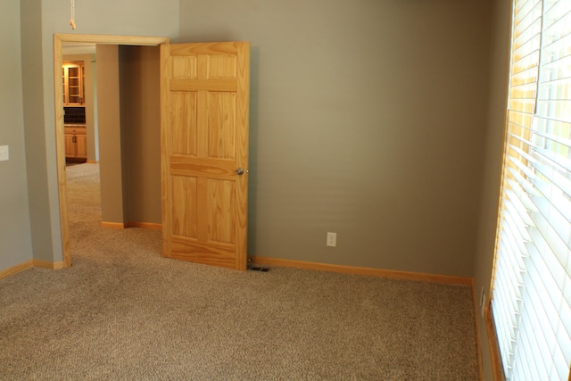 spare room with carpet