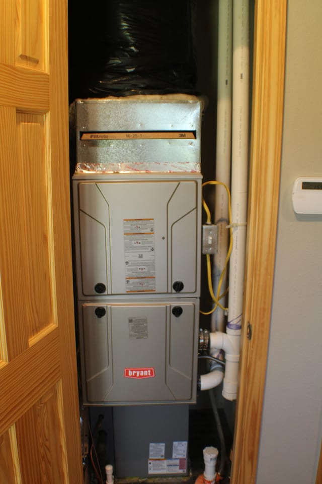 utility room with heating unit