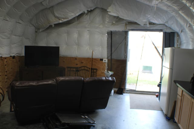 living room featuring concrete flooring