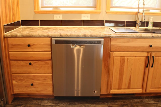 kitchen featuring plenty of natural light, sink, and dishwasher