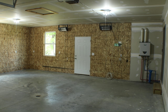 garage featuring tankless water heater