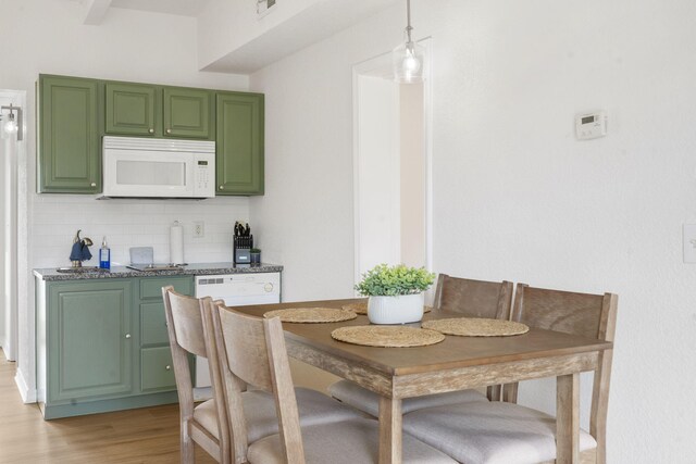 dining space with light wood-style flooring