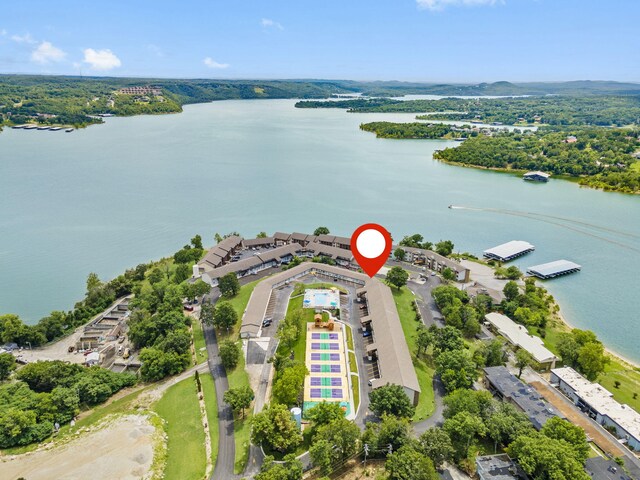 birds eye view of property with a water view