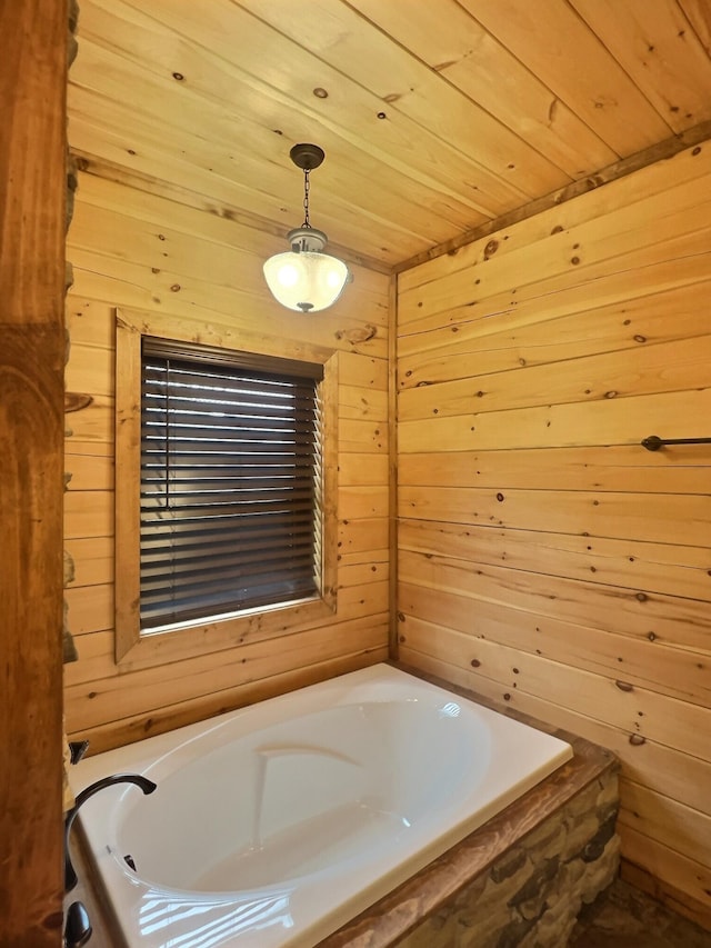 bathroom featuring a bathing tub, wood walls, and wood ceiling