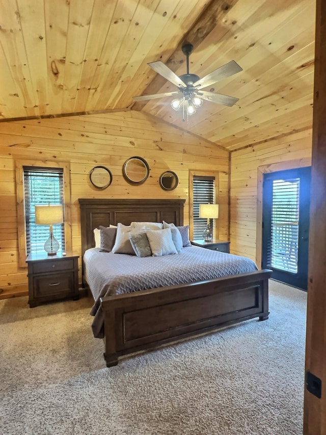 carpeted bedroom featuring lofted ceiling, wooden ceiling, wooden walls, and ceiling fan