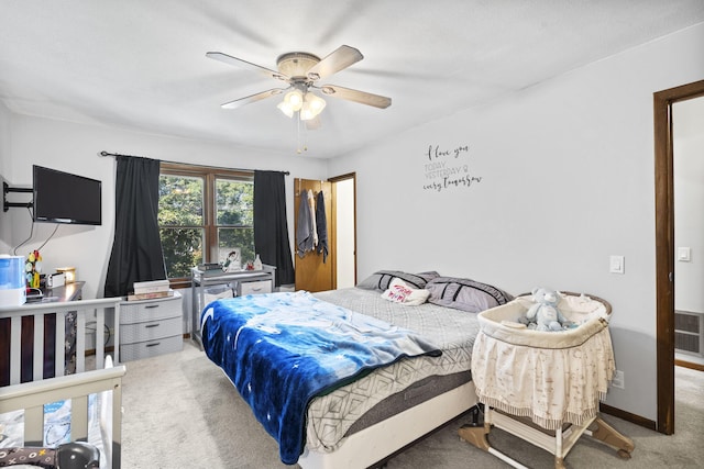 bedroom with carpet, baseboards, and ceiling fan