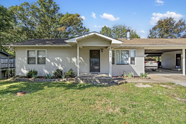 single story home with a carport, a front lawn, and concrete driveway