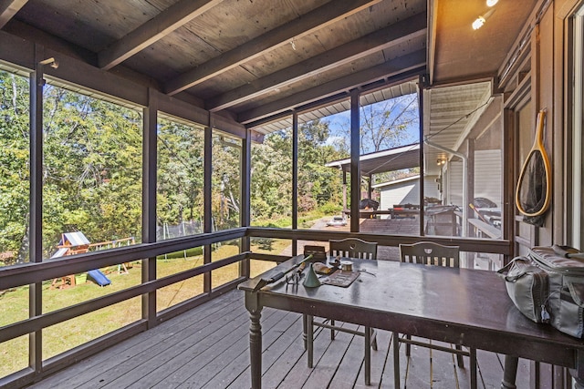 sunroom with wooden ceiling and beamed ceiling